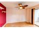 Bright bedroom with a ceiling fan and sliding glass door to the balcony at 12480 W Nevada Pl # 214, Lakewood, CO 80228