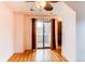 Bedroom features a ceiling fan, sliding glass door, and neutral walls at 12480 W Nevada Pl # 214, Lakewood, CO 80228