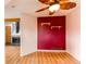 Spacious living room area with decorative shelves and bright lighting and fireplace at 12480 W Nevada Pl # 214, Lakewood, CO 80228