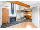 Inviting living room featuring a fireplace, wood beam, and mirrored closet doors at 12480 W Nevada Pl # 214, Lakewood, CO 80228