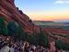 Sunset view from Red Rocks Amphitheater overlooking the vibrant crowd and picturesque landscape at 12480 W Nevada Pl # 214, Lakewood, CO 80228