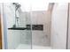 New walk-in shower featuring a rainfall shower head, black hardware and light tile surround at 12480 W Nevada Pl # 214, Lakewood, CO 80228
