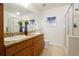Bathroom boasts double sinks, granite countertops, and a glass-enclosed shower at 1950 N Logan St # 102, Denver, CO 80203