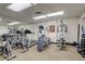 Well-equipped fitness center with cardio machines, weights, and ample workout space at 1950 N Logan St # 102, Denver, CO 80203