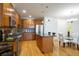 Modern kitchen featuring stainless steel appliances, granite countertops, and wood cabinets at 1950 N Logan St # 102, Denver, CO 80203