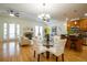 Bright and airy living room featuring hardwood floors, a fireplace, and an open floor plan at 1950 N Logan St # 102, Denver, CO 80203