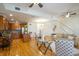 Bright and airy living room featuring hardwood floors, stairs, and an open floor plan at 1950 N Logan St # 102, Denver, CO 80203