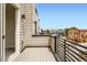 Balcony with metal railing and wood floor at 3520 W Conejos Pl # 11, Denver, CO 80204