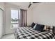 Bedroom with large window and ceiling fan at 3520 W Conejos Pl # 11, Denver, CO 80204