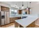 Modern kitchen featuring stainless steel appliances, white countertops and custom wood cabinets at 3520 W Conejos Pl # 11, Denver, CO 80204