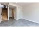 Spacious living room featuring a staircase, closet and access to other rooms at 3520 W Conejos Pl # 11, Denver, CO 80204