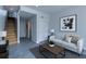 Inviting living room featuring neutral tones, modern decor, and a staircase at 3520 W Conejos Pl # 11, Denver, CO 80204