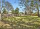 This spacious backyard is surrounded by a wood fence and mature trees at 50 Yarrow St, Lakewood, CO 80226