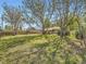 Large backyard with mature trees providing shade and privacy for the home at 50 Yarrow St, Lakewood, CO 80226