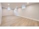 Finished basement with wood-look flooring and plenty of natural light at 50 Yarrow St, Lakewood, CO 80226