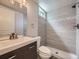 Modern bathroom features a sleek vanity, contemporary fixtures, and a stylish tiled shower at 50 Yarrow St, Lakewood, CO 80226