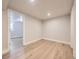 This light-filled room features neutral walls, recessed lighting and wood-look flooring at 50 Yarrow St, Lakewood, CO 80226