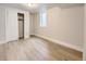 This bedroom features a closet with sliding doors and a window for natural light at 50 Yarrow St, Lakewood, CO 80226