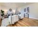 Bright living room with hardwood floors, neutral decor, and comfortable seating arrangement at 50 Yarrow St, Lakewood, CO 80226