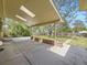 Covered patio overlooking the landscaped backyard, providing a great outdoor living space at 50 Yarrow St, Lakewood, CO 80226