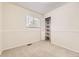 Cozy bedroom features neutral carpet, closet with shelving, and a window with natural light at 6348 S Independence St, Littleton, CO 80123