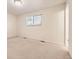Bedroom featuring plush carpet, window with blinds, and bright neutral walls at 6348 S Independence St, Littleton, CO 80123