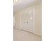 Bedroom featuring bi-fold closet doors, plush carpet and neutral decor at 6348 S Independence St, Littleton, CO 80123