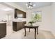Bright dining area featuring a chandelier, a large window, and seamless flow into the kitchen at 6348 S Independence St, Littleton, CO 80123