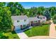 Beautifully maintained home with a lush front yard, featuring a brick and siding exterior at 6348 S Independence St, Littleton, CO 80123