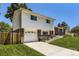 Two-story home with a well-manicured lawn and a combination of brick and siding at 6348 S Independence St, Littleton, CO 80123