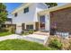 Charming two-story home showcasing a brick facade, white siding, and inviting front entrance with landscaped yard at 6348 S Independence St, Littleton, CO 80123