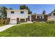 Inviting two-story home with a well-manicured lawn, a driveway, and a combination of brick and siding at 6348 S Independence St, Littleton, CO 80123