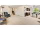 Large living room with adjoining kitchen and staircase at 6348 S Independence St, Littleton, CO 80123