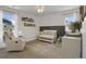 This Bedroom features a crib and a comfortable chair with lots of natural light at 4391 S Nepal St, Centennial, CO 80015