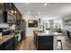Open-concept kitchen featuring granite countertops, stainless steel appliances, and seamless flow into the living area at 4391 S Nepal St, Centennial, CO 80015