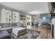 Inviting living room with modern decor, plush seating, and an open layout leading to the dining area at 4391 S Nepal St, Centennial, CO 80015