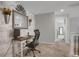This home office features wood wall accents and an open floorplan at 4391 S Nepal St, Centennial, CO 80015