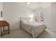 Cozy bedroom featuring a bed with paisley bedding, a desk, and ample natural light at 410 Acoma St # 314, Denver, CO 80204