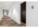 Hallway of unit showing a brown door labeled 314 with carpeted floors and white walls at 410 Acoma St # 314, Denver, CO 80204