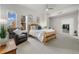 A spacious main bedroom with large windows, a ceiling fan, and a cozy reading nook at 410 Acoma St # 314, Denver, CO 80204