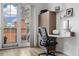 A well-lit office area with a sleek desk, modern chair, and access to a private balcony at 410 Acoma St # 314, Denver, CO 80204