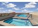 Community rooftop pool and hot tub offering city and mountain views on a sunny day at 410 Acoma St # 314, Denver, CO 80204