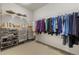 Well-organized walk-in closet featuring ample storage space for clothes, shoes, and accessories at 410 Acoma St # 314, Denver, CO 80204