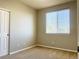 Neutral bedroom with carpet, a closet, and a window providing natural light at 8726 S Kline St # A208, Littleton, CO 80127