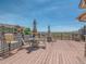 Spacious outdoor deck with tables, chairs, and scenic views at 8726 S Kline St # A208, Littleton, CO 80127