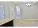 Open dining space with neutral walls, a chandelier, and easy access to the kitchen at 8726 S Kline St # A208, Littleton, CO 80127
