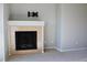 Neutral living space featuring a cozy fireplace with stone accents and a mounted tv bracket at 8726 S Kline St # A208, Littleton, CO 80127