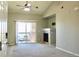 Well-lit living room with a fireplace, balcony access, and neutral color palette at 8726 S Kline St # A208, Littleton, CO 80127
