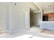 An inviting living space with neutral decor and a seamless flow to the kitchen and dining area at 8726 S Kline St # A208, Littleton, CO 80127