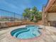 Inviting hot tub area with blue tile and easy access steps and handrail at 8726 S Kline St # A208, Littleton, CO 80127